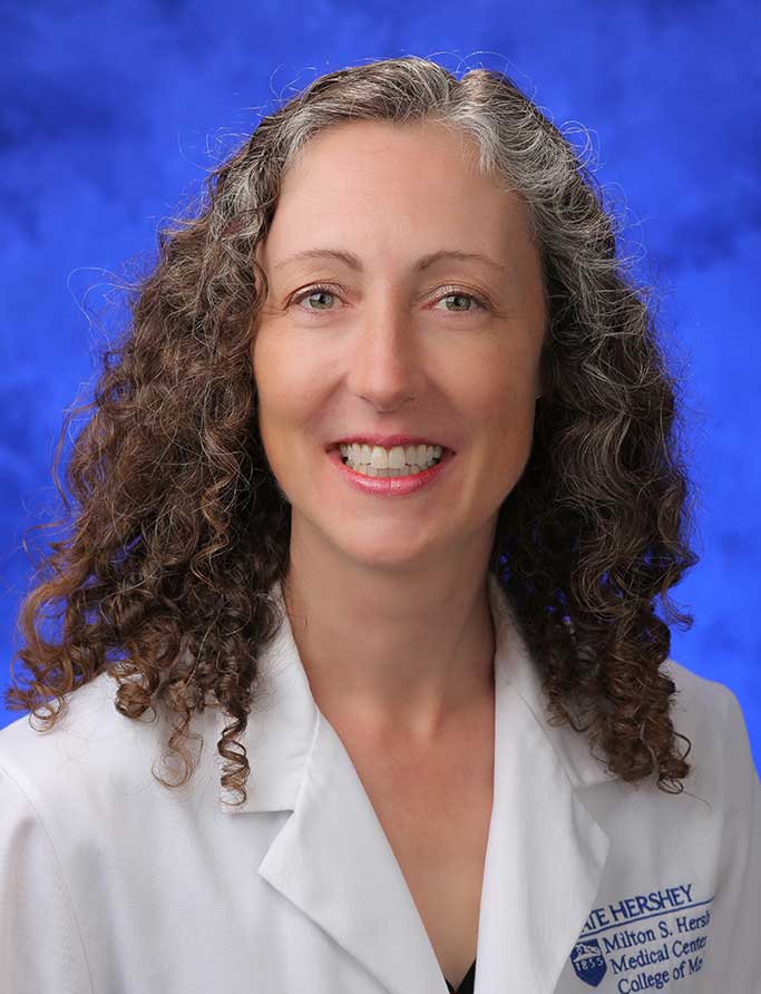 Colette Pameijer, MD, is Interim Chair of the Department of Surgery at Penn State College of Medicine. She is pictured in a medical coat against a professional photo background.