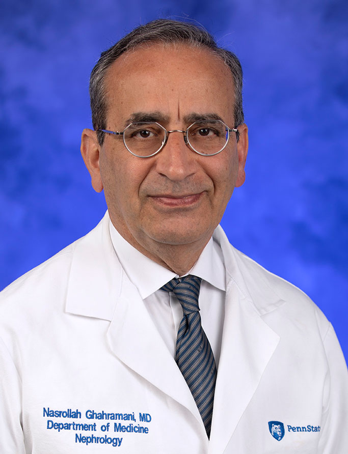 Nasrollah Ghahramani, MD, MS, is Interim Chair of the Department of Medicine at Penn State College of Medicine. He is pictured in a medical coat, dress shirt and tie against a professional photo background.