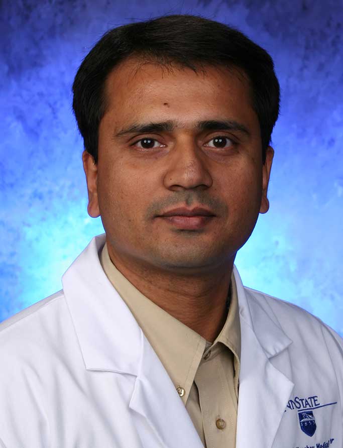 A head-and-shoulders portrait of Sangam Kanekar, MD