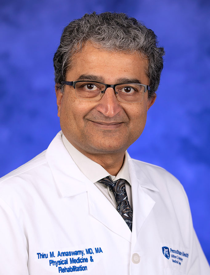 Thiru Annaswamy, MD, MA, is Chair of the Department of Physical Medicine and Rehabilitation at Penn State College of Medicine. He is pictured in a white medical coat.